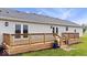 Spacious wooden deck with railing and steps to backyard at 9605 W 100 S, Jamestown, IN 46147