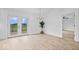 Open dining area with light wood floors, access to a deck, and a modern chandelier at 9605 W 100 S, Jamestown, IN 46147