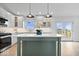 Bright kitchen features a large island, modern appliances, and a view of the backyard at 9605 W 100 S, Jamestown, IN 46147