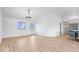 Spacious living room boasts light wood floors, natural light, and access to other rooms at 9605 W 100 S, Jamestown, IN 46147