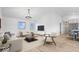 Bright living room with light hardwood floors, white walls, modern furniture, and chandelier lighting at 9605 W 100 S, Jamestown, IN 46147