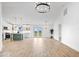 Open-concept living space featuring a modern kitchen, dining area, and light wood floors at 9605 W 100 S, Jamestown, IN 46147