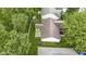 Aerial view of a cozy home with a fenced backyard, surrounded by lush greenery, providing privacy and a peaceful setting at 975 Atir Ln, Greenfield, IN 46140
