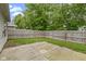 Backyard features a privacy fence, small grassy area and a concrete patio at 975 Atir Ln, Greenfield, IN 46140