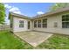The home's backyard has a concrete patio and view of the back exterior at 975 Atir Ln, Greenfield, IN 46140