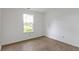 Bright bedroom features wood-look floors and a window view of the outdoors at 975 Atir Ln, Greenfield, IN 46140