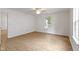 Bright bedroom featuring wood floors, a ceiling fan, and natural light from a window at 975 Atir Ln, Greenfield, IN 46140