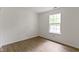 Well-lit bedroom features wood-look floors and neutral walls to compliment any decor at 975 Atir Ln, Greenfield, IN 46140