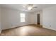 Comfortable bedroom featuring wood floors, a ceiling fan, and natural light from a window at 975 Atir Ln, Greenfield, IN 46140