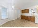 Inviting dining area with wood floors, a hanging light fixture, and bright natural light at 975 Atir Ln, Greenfield, IN 46140