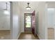 Bright foyer with hardwood floors, a modern light fixture, and a welcoming entrance at 975 Atir Ln, Greenfield, IN 46140