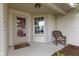 Cozy front porch featuring a rocking chair, decorative rug, and ample natural light at 975 Atir Ln, Greenfield, IN 46140
