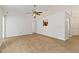 Spacious living room with wood floors, a ceiling fan, and an open view to the kitchen area at 975 Atir Ln, Greenfield, IN 46140