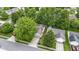 A peaceful suburban street showcasing a home with a well-manicured yard and mature trees, enhancing its curb appeal at 975 Atir Ln, Greenfield, IN 46140