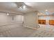 Finished basement featuring bar, carpet and neutral paint at 10501 Greenway Dr, Fishers, IN 46037