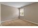 Simple bedroom with a neutral-toned wall and window, ready for personalization at 10501 Greenway Dr, Fishers, IN 46037