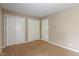 Standard bedroom featuring 3 doors, neutral walls, and carpet flooring at 10501 Greenway Dr, Fishers, IN 46037