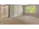 Spacious bedroom with a window and an open door, showing great potential at 10501 Greenway Dr, Fishers, IN 46037