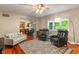 Bright living room offers hardwood floors, comfortable seating, and a view into the kitchen at 10501 Greenway Dr, Fishers, IN 46037