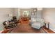 Cozy living room with hardwood floors, a gray sofa, stylish furniture, and an oriental rug at 10501 Greenway Dr, Fishers, IN 46037