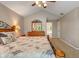 Comfortable main bedroom featuring a decorative mirror and access to the ensuite bathroom at 10501 Greenway Dr, Fishers, IN 46037