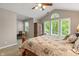 Vaulted ceilings and a cozy sitting area make this main bedroom an appealing retreat at 10501 Greenway Dr, Fishers, IN 46037