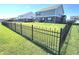 Spacious fenced backyard surrounded by green grass, offers privacy and security in this outdoor space at 1056 Bent Branch Ln, Greenwood, IN 46143