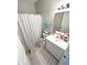 Clean, modern bathroom with neutral colors, tiled floor, and shower at 1056 Bent Branch Ln, Greenwood, IN 46143