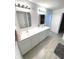 Bathroom with double vanity, subway tile backsplash, and modern mirrors at 1056 Bent Branch Ln, Greenwood, IN 46143