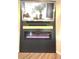 Close up of modern fireplace below TV and decorative wood mantle at 1056 Bent Branch Ln, Greenwood, IN 46143
