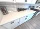 Modern kitchen featuring white cabinets, subway tile backsplash, and quartz countertops at 1056 Bent Branch Ln, Greenwood, IN 46143