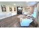 Cozy living room features hardwood floors, a modern fireplace, and comfortable seating with ample natural light at 1056 Bent Branch Ln, Greenwood, IN 46143