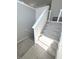Carpeted stairway with white railing and natural light at 1056 Bent Branch Ln, Greenwood, IN 46143