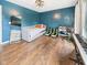 Stylish bedroom featuring laminate flooring, a comfy daybed, and modern decor, creating a relaxing retreat at 1117 Oregon Way, Anderson, IN 46012