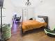 Relaxing bedroom with a ceiling fan, desk, hardwood floors and natural light at 1117 Oregon Way, Anderson, IN 46012