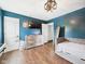 Stylish bedroom with laminate flooring, a comfy daybed, and modern decor, creating a relaxing retreat at 1117 Oregon Way, Anderson, IN 46012