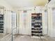 Mirrored walk-in closet featuring shelving, hanging rods, and natural light at 1117 Oregon Way, Anderson, IN 46012