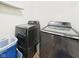 Convenient laundry room with modern, front-loading washer and dryer at 1117 Oregon Way, Anderson, IN 46012