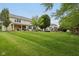 Spacious backyard with well-maintained lawn, covered patio, ideal for relaxation and outdoor activities at 11844 Pine Meadow Cir, Fishers, IN 46037