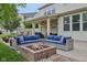 Large backyard showcasing a covered patio, fire pit, and landscaped areas for outdoor enjoyment at 11844 Pine Meadow Cir, Fishers, IN 46037