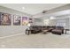 Finished basement featuring a large sectional, movie posters, projector and neutral carpeting for a living space at 11844 Pine Meadow Cir, Fishers, IN 46037