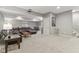 Finished basement showcasing a projector, dark leather sectional, carpet, and a small table with chairs for a living space at 11844 Pine Meadow Cir, Fishers, IN 46037