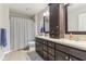 This bathroom includes double vanities, granite countertop, framed mirrors, and a tiled shower at 11844 Pine Meadow Cir, Fishers, IN 46037