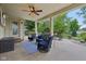Covered patio features a ceiling fan, recessed lighting and an outdoor seating area for relaxing or entertaining at 11844 Pine Meadow Cir, Fishers, IN 46037
