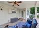Covered patio with outdoor television, outdoor seating, and convenient access to the backyard at 11844 Pine Meadow Cir, Fishers, IN 46037
