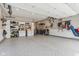 Spacious garage with epoxy floor, overhead storage, and white cabinets for tools and accessories at 11844 Pine Meadow Cir, Fishers, IN 46037