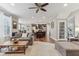 Open concept design with a spacious living room flowing into a kitchen and dining area at 11844 Pine Meadow Cir, Fishers, IN 46037