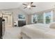 Spacious main bedroom offers vaulted ceilings, a walk-in closet, and soft, neutral colors and carpet at 11844 Pine Meadow Cir, Fishers, IN 46037