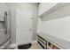 Functional mudroom with built-in bench, storage shelves, and convenient access to the garage at 11844 Pine Meadow Cir, Fishers, IN 46037
