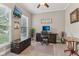 Cozy home office with modern furnishings, ample natural light, and a comfortable workspace at 11844 Pine Meadow Cir, Fishers, IN 46037